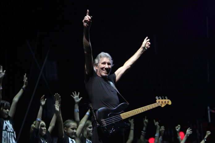 Former Pink Floyd co-founder and bass guitarist Waters performs with a Romanian children choir during "The Wall" tour live concert in Bucharest