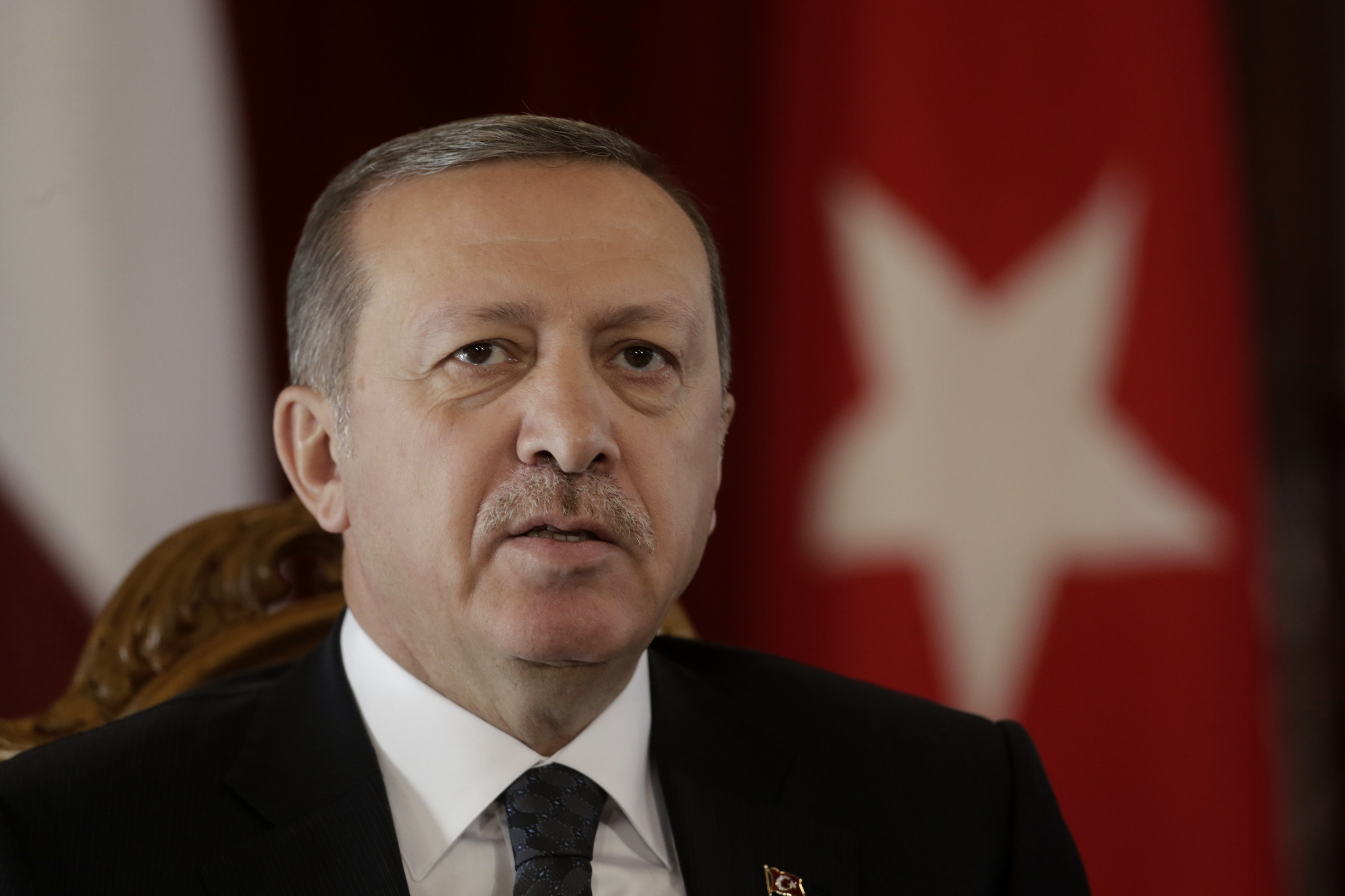 Turkey's President Erdogan speaks during a news conference in Riga