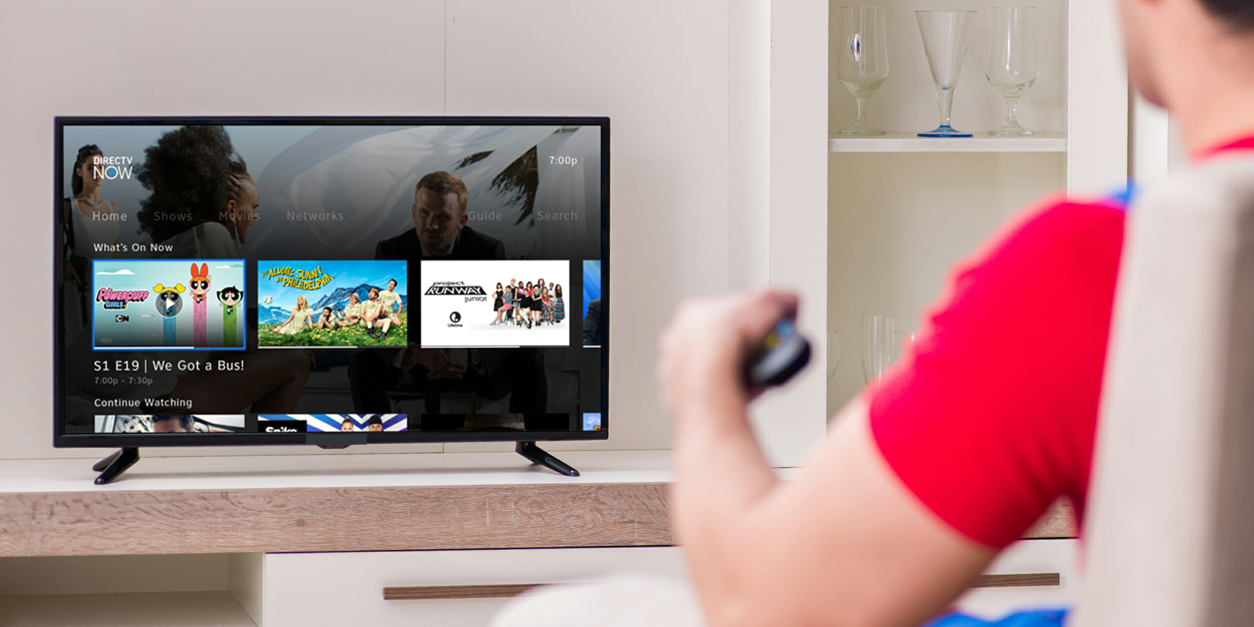 man-watching-directv-now