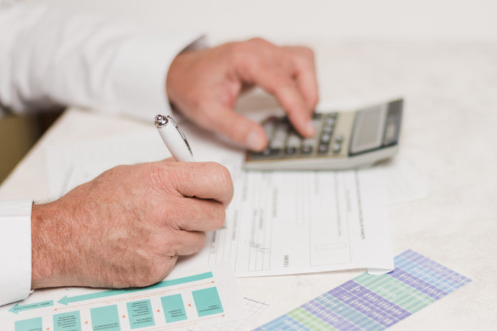 businessman-using-calculator