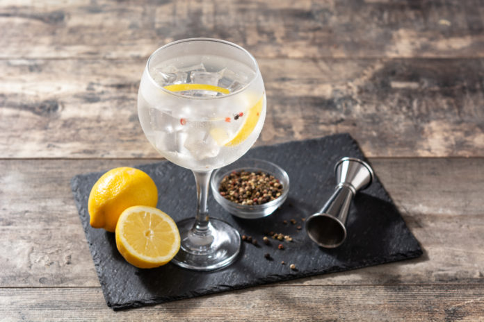 Gin tonic cocktail drink into a glass
